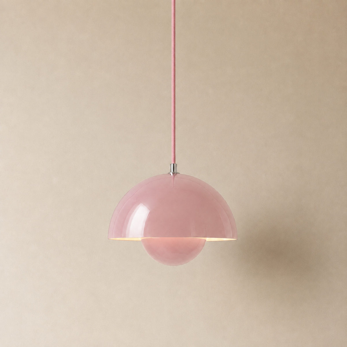 Ave hemisphere pendant in pink on a matching rose-pink fabric cord, 16 cm tall
