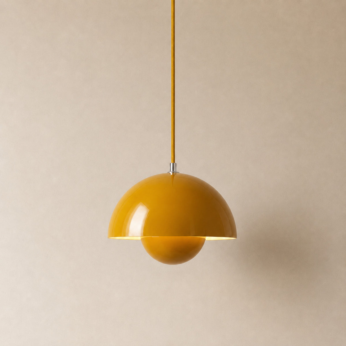 Ave hemisphere pendant in sand turmeric on a matching fabric cord, 16 cm tall