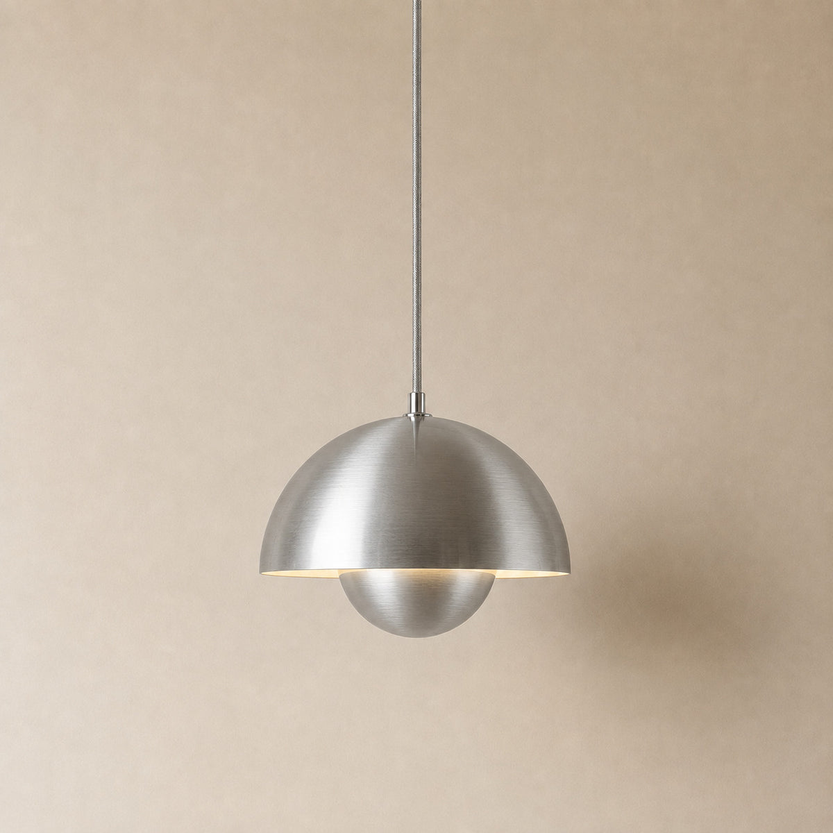 Ave hemisphere pendant in silver on a matching fabric cord, 16 cm tall