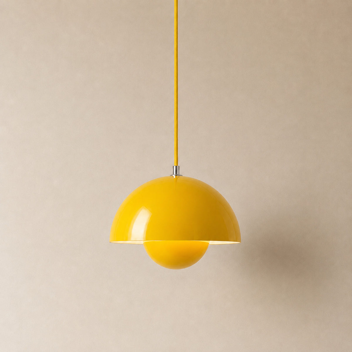Ave hemisphere pendant in yellow on a matching fabric cord, 16 cm tall