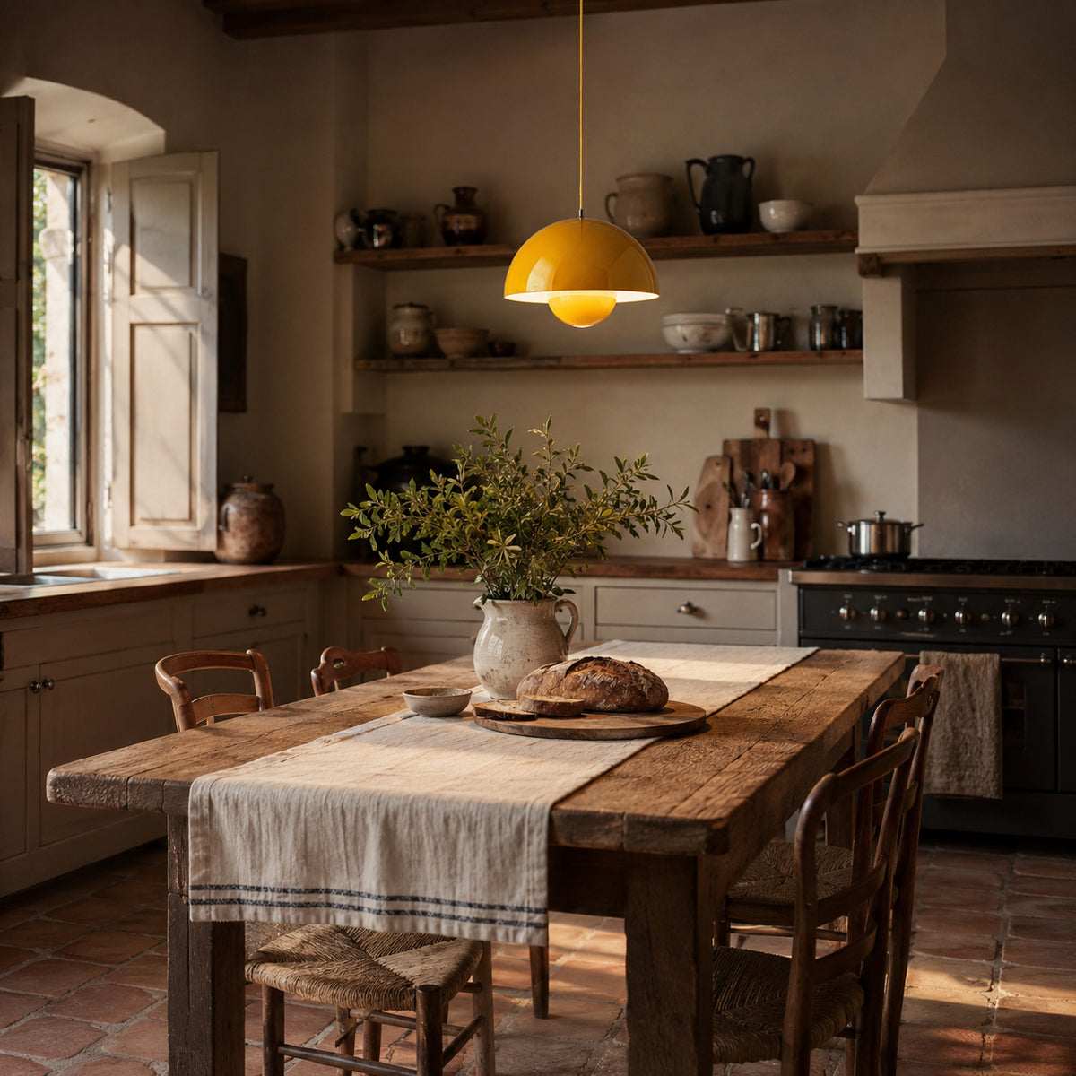 Ave hemisphere pendant in yellow on a matching fabric cord, 16 cm tall, shown in a room