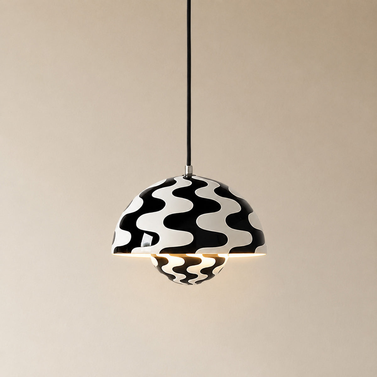 Ave hemisphere pendant in zebra color on a plain black fabric cord, 16 cm tall