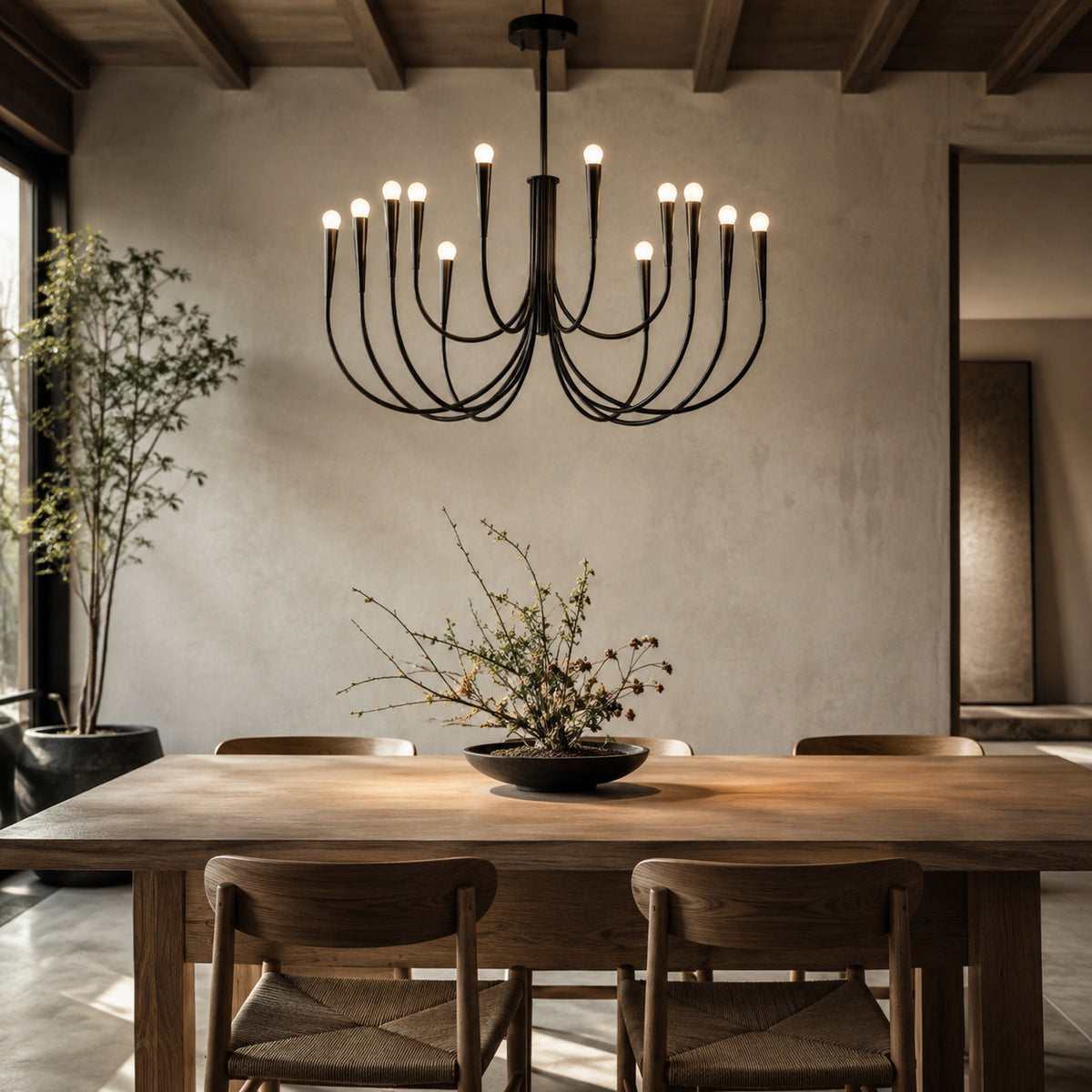 Balsemão curved-arm chandelier in matte black with 12 arms, shown in a room