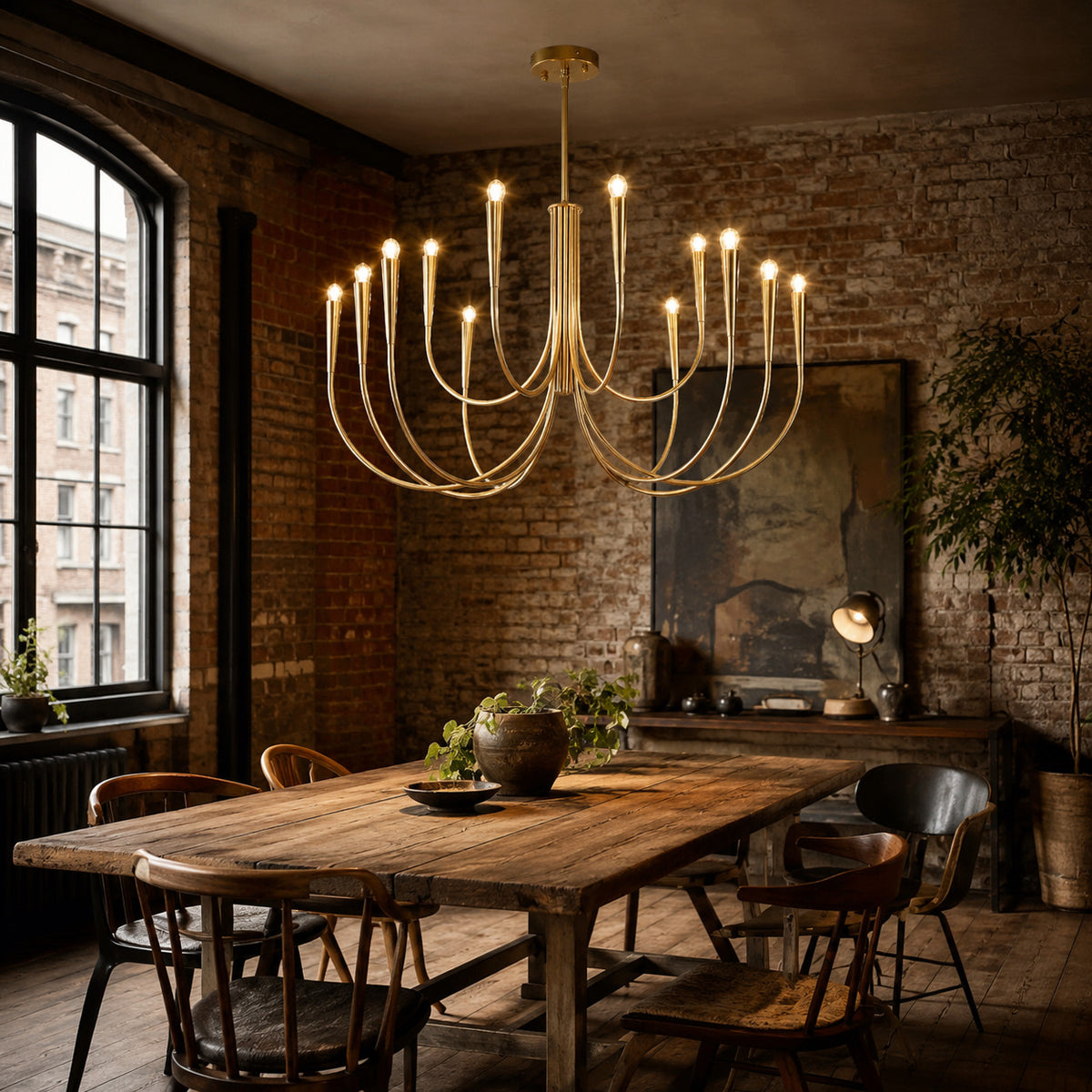 Balsemão curved-arm chandelier in polished gold with 12 arms, shown in a room