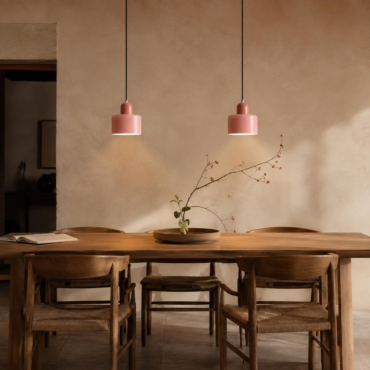 Barcelos Bauhaus glass mini pendant light in pink, hung as a row of 2 in a dining room.