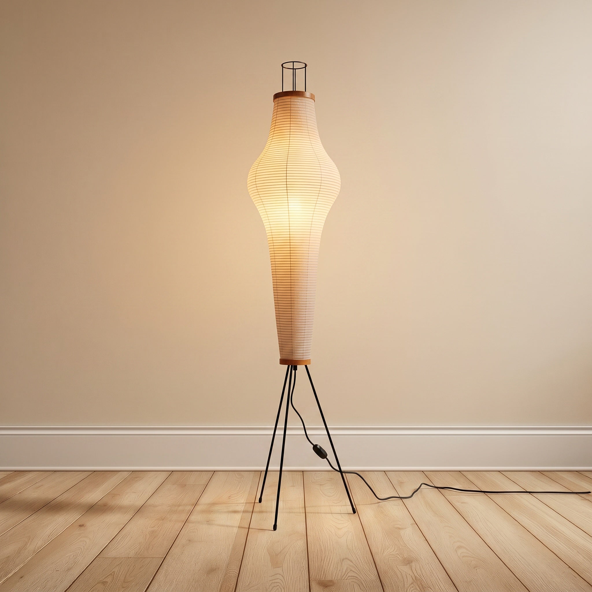 Mulberry-paper floor lamp, elongated taper shape on a black tripod, product shot.