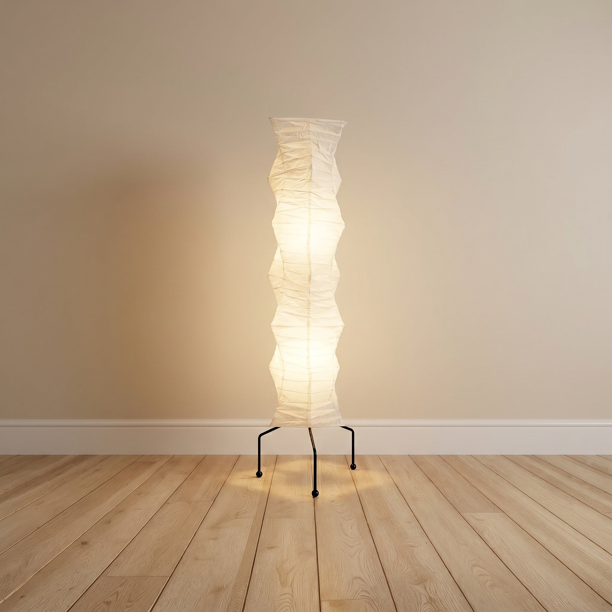 Mulberry-paper floor lamp, stacked geometric shape on a black tripod, product shot.
