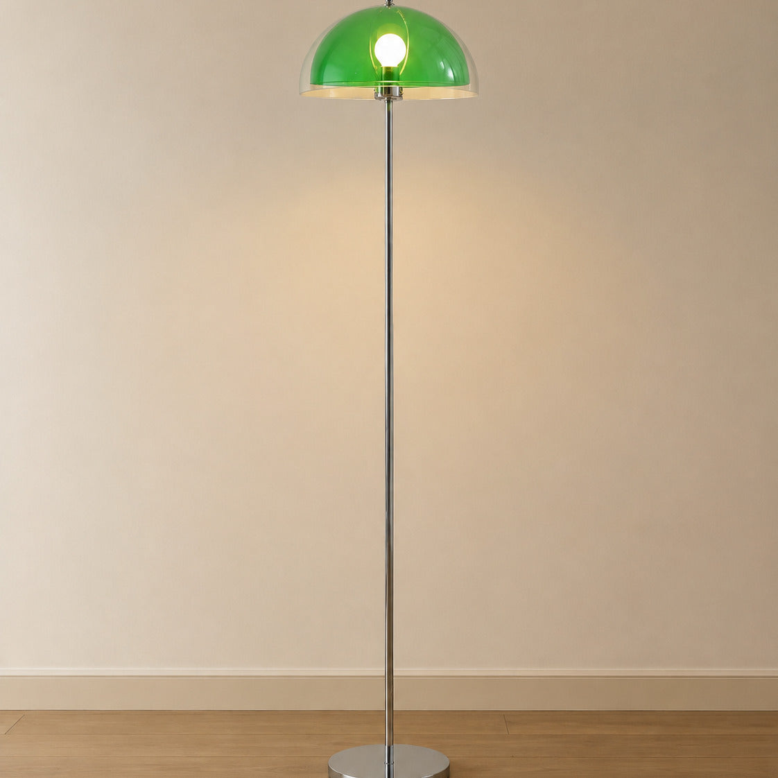 Benavente floor lamp with a fresh mid-green inner dome under a clear acrylic outer shade, chrome stem, 155 cm tall