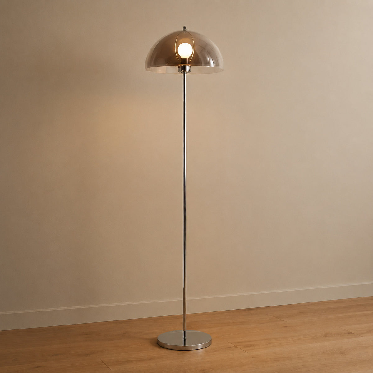 Benavente floor lamp with a warm smoked-brown inner dome under a clear acrylic outer shade, chrome stem, 155 cm tall