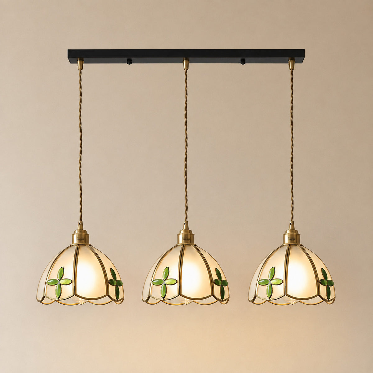 Burgau three-light bar of leaded glass pendants with white and green accents, each 18 cm tall