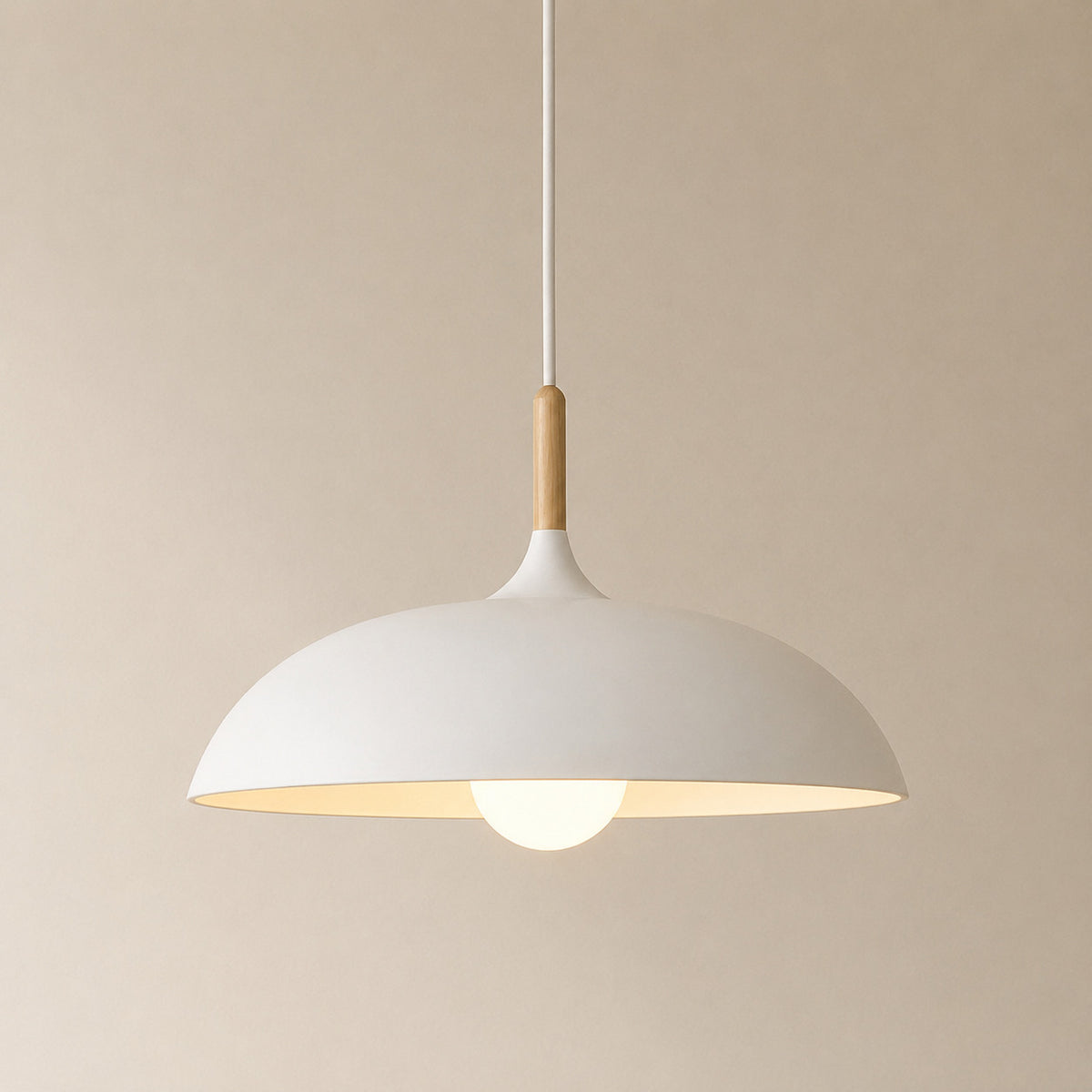 Cobres pendant in flat matte white with a turned wood cap, the wide shallow Flat Sphere shade