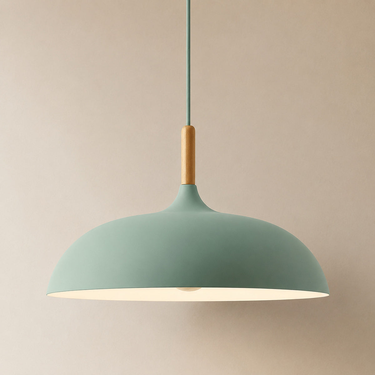 Cobres pendant in fresh mid-green with a turned wood cap, the wide shallow Flat Sphere shade