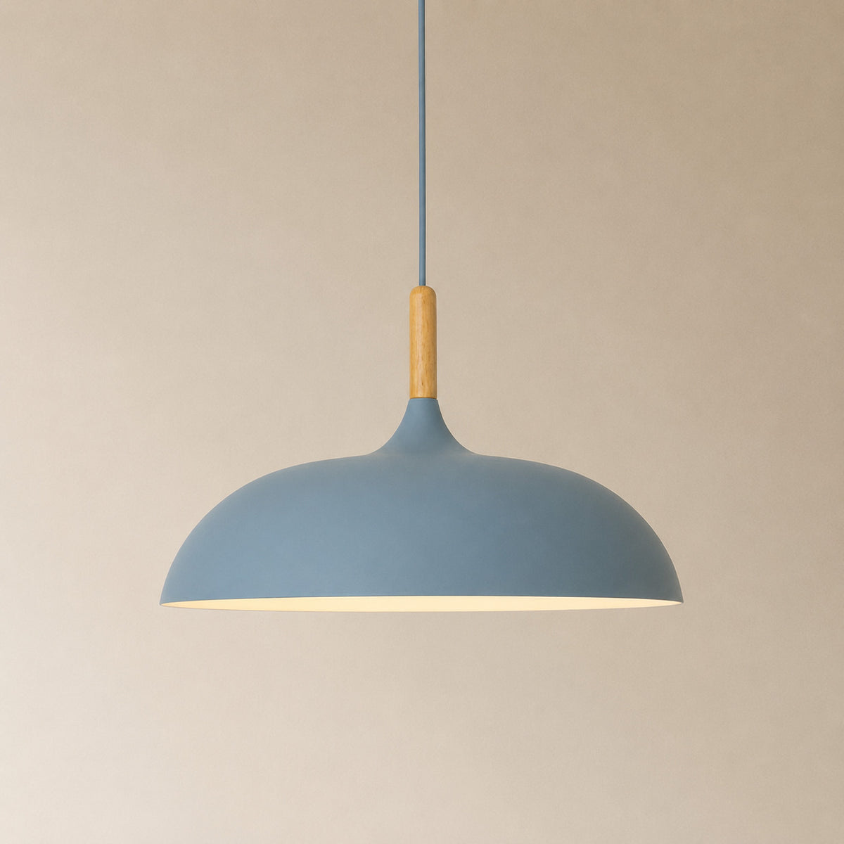 Cobres pendant in muted dusty blue with a turned wood cap, the wide shallow Flat Sphere shade