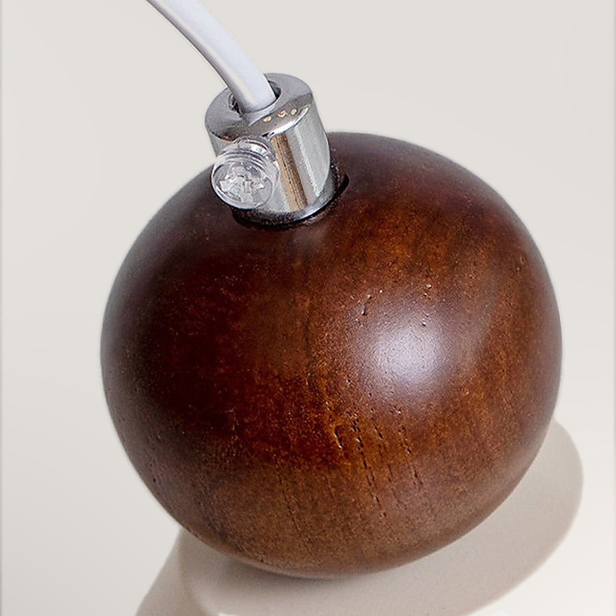 Covilhã cone pendant light, the walnut ball where the cord meets the shade.