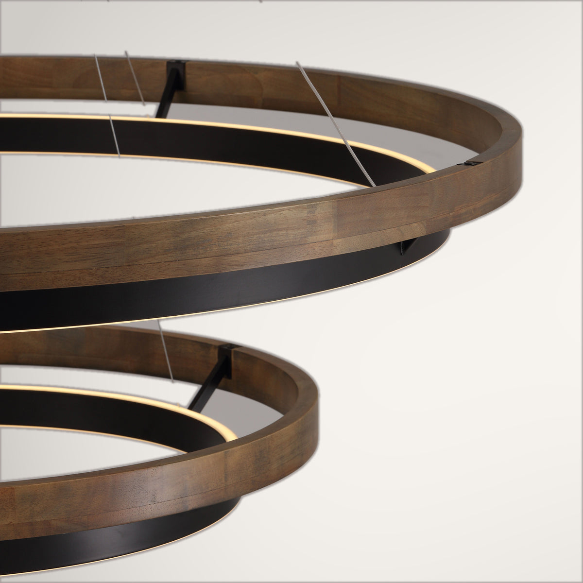 Espargos circular ceiling light, both wood rings and their suspension cables seen from below.