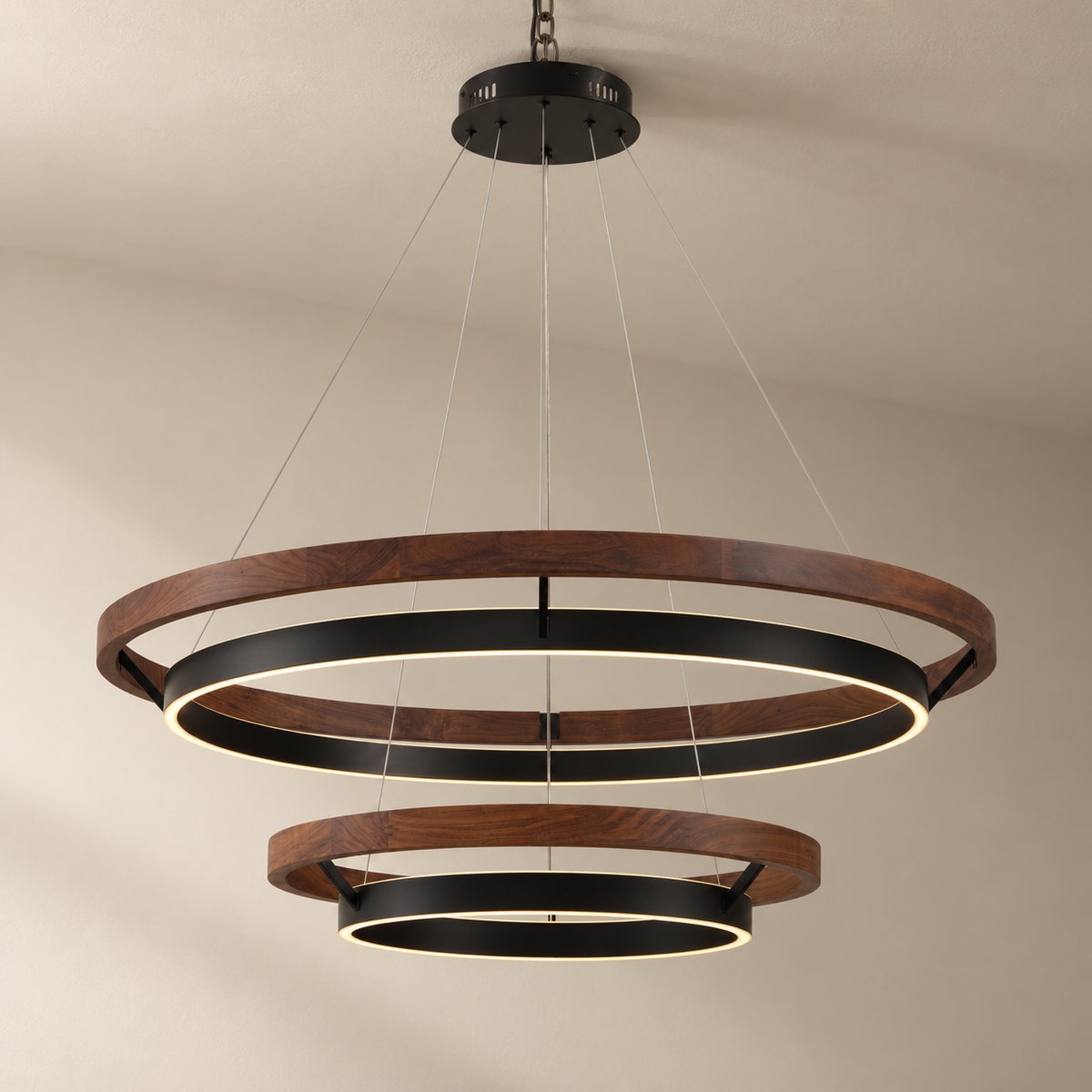 Espargos circular LED ceiling light in walnut, two tiers, 100 and 60 cm, on a plain ceiling.