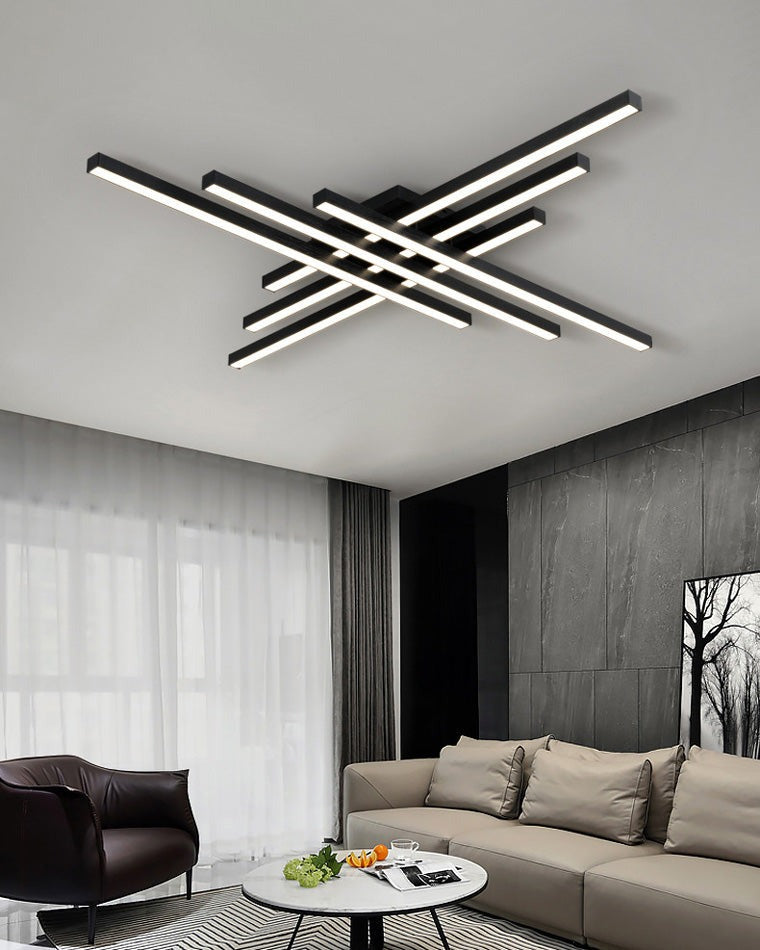 Esposende linear flush mount ceiling light, in a living room, above a leather sofa.