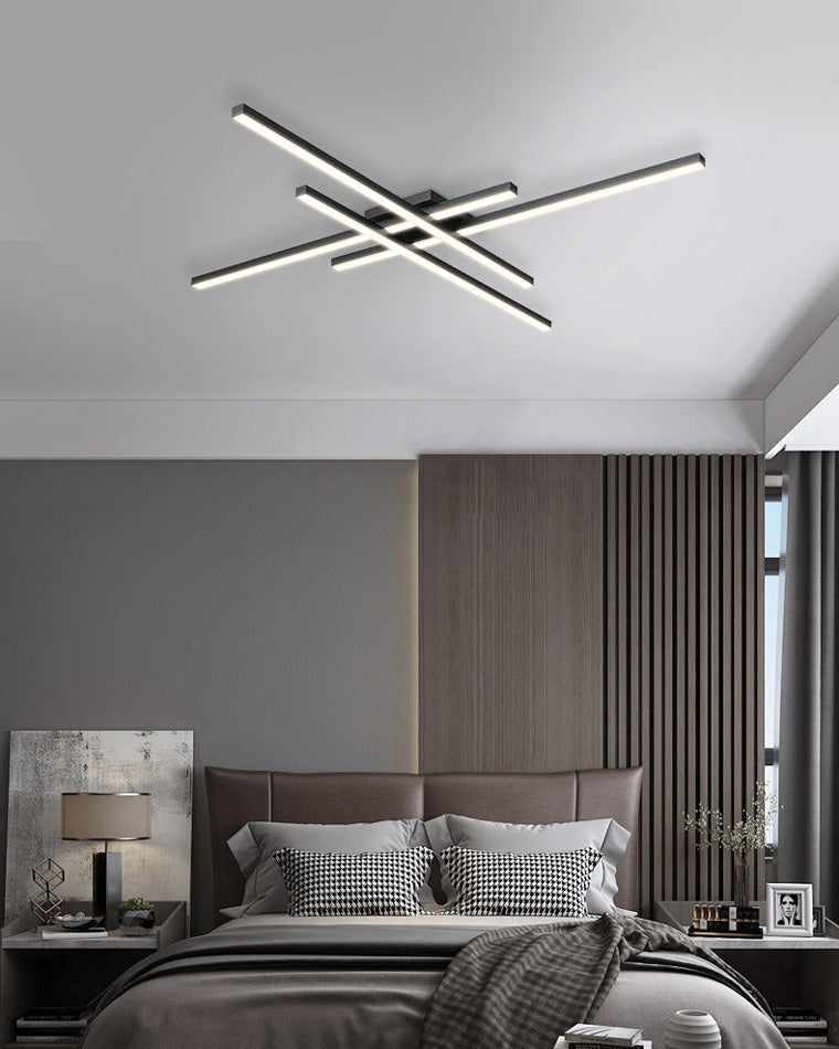 Esposende linear flush mount ceiling light, in a bedroom, above a panelled headboard.