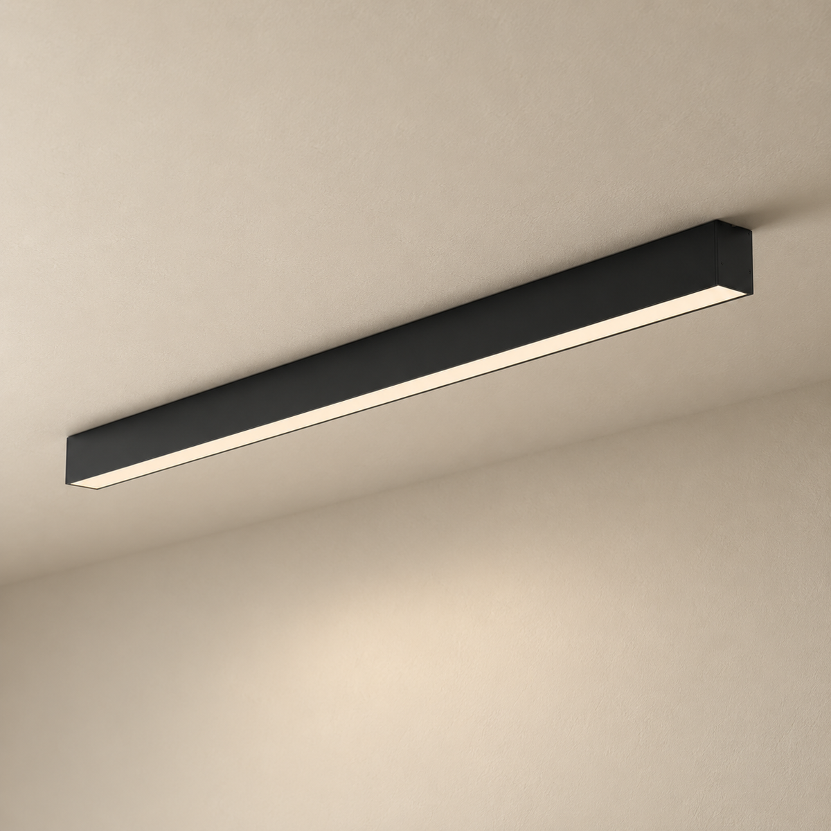 Estarreja linear ceiling light in black, on a plain ceiling.