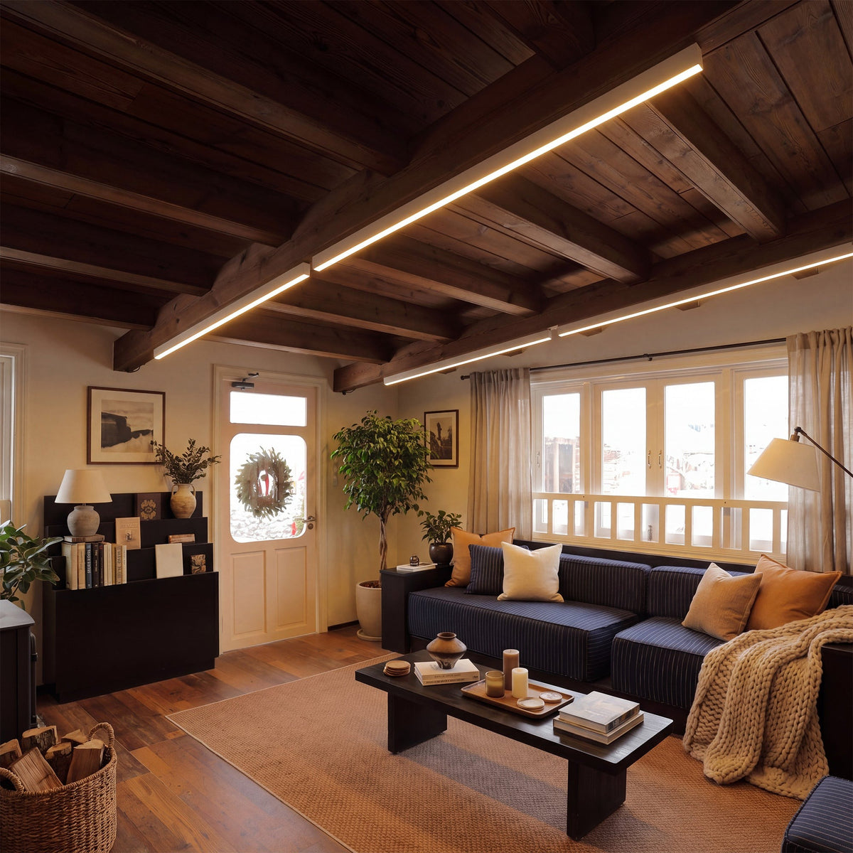 Estarreja linear ceiling light, in a living room, under a timber beamed ceiling.
