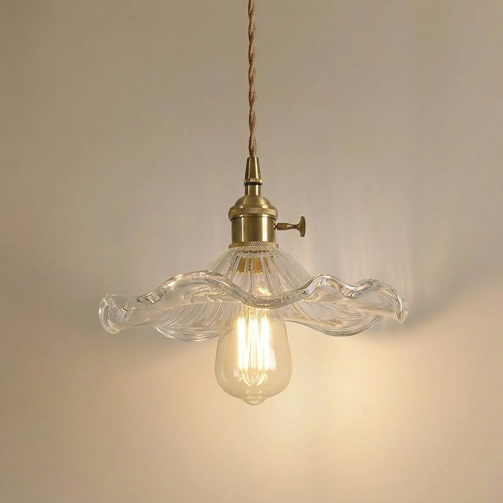 Ferragudo clear glass flower pendant light with brass fitting and lit Edison bulb