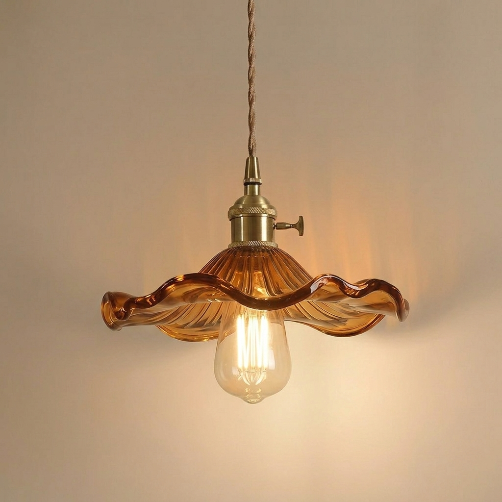 Ferragudo brown glass flower pendant light with brass fitting and lit Edison bulb