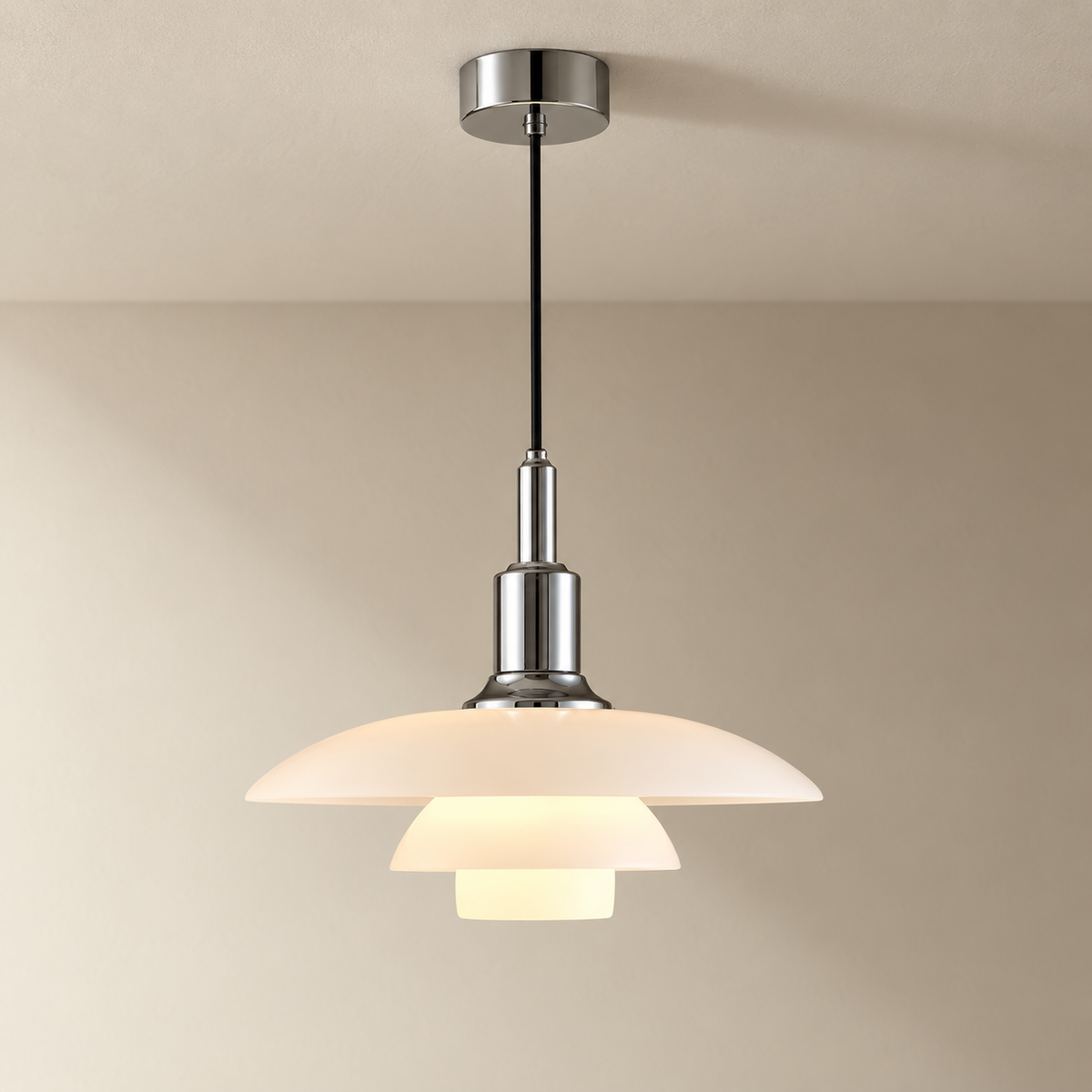 Fundão round ceiling light in chrome, on a plain ceiling.