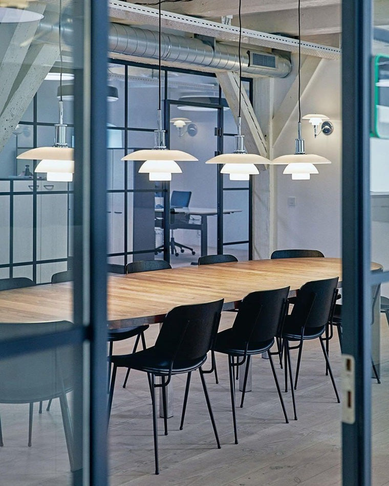Fundão round ceiling light, in a home office, in a glass walled meeting room.
