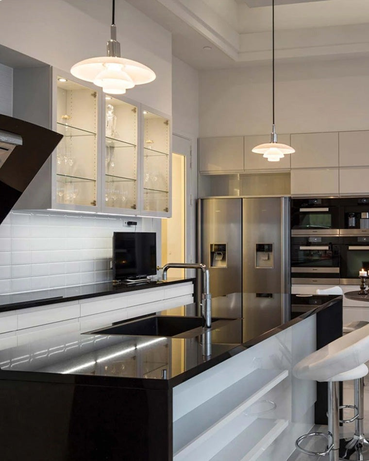 Fundão round ceiling light, in a kitchen, in a stainless steel kitchen.