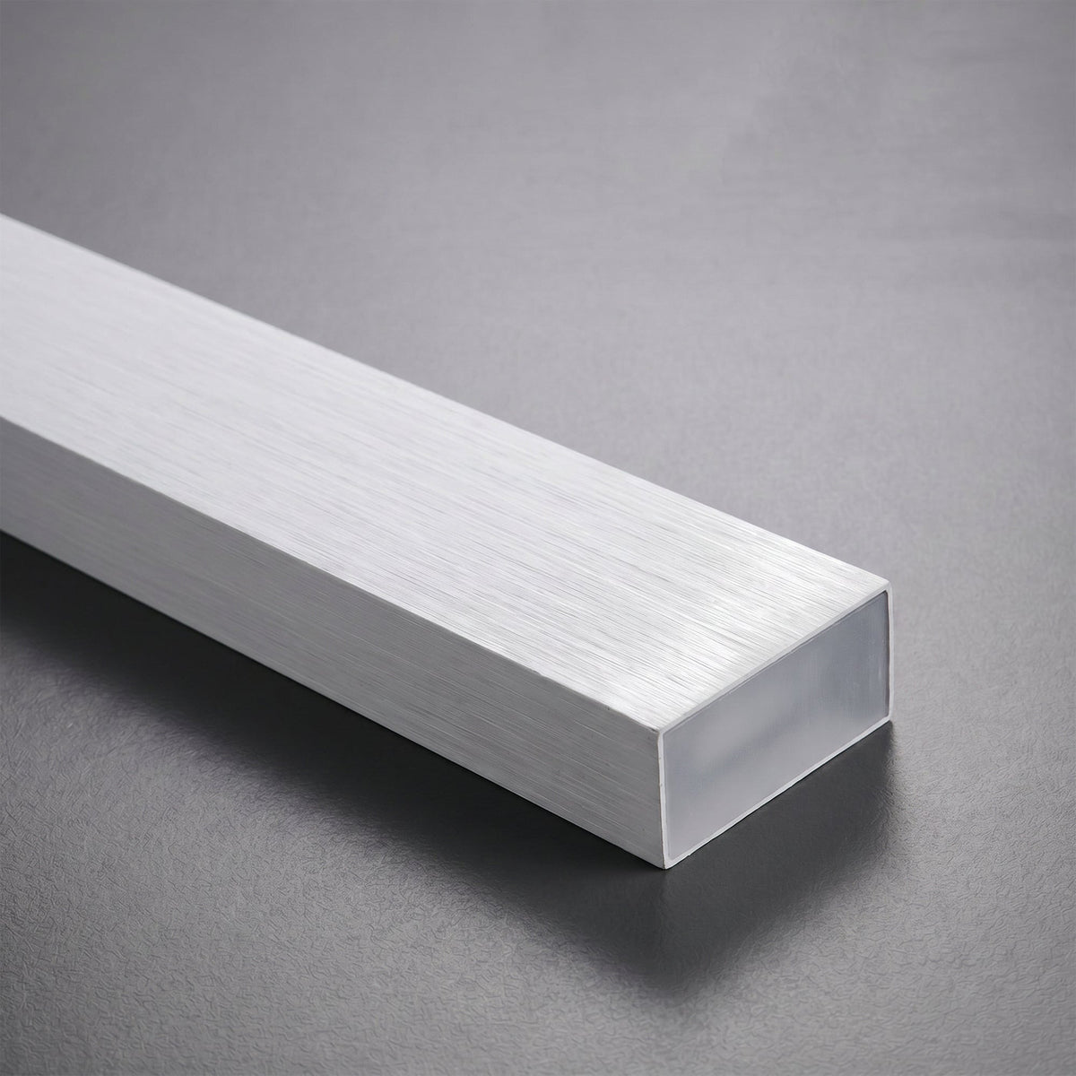 Góis linear LED ceiling light, close detail of the finish and fittings, the brushed aluminium end.