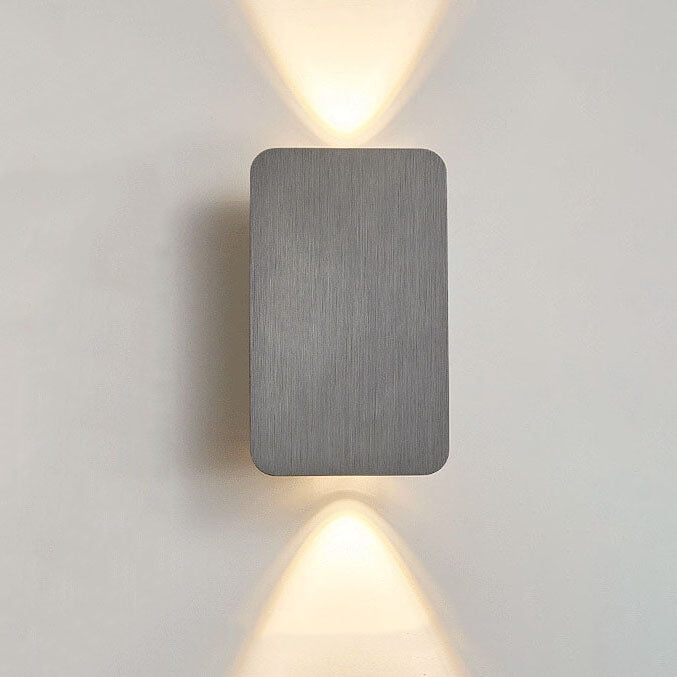 Guarda wall sconce in gray, brushed aluminum flat 2-light panel casting warm up and down beams, front view