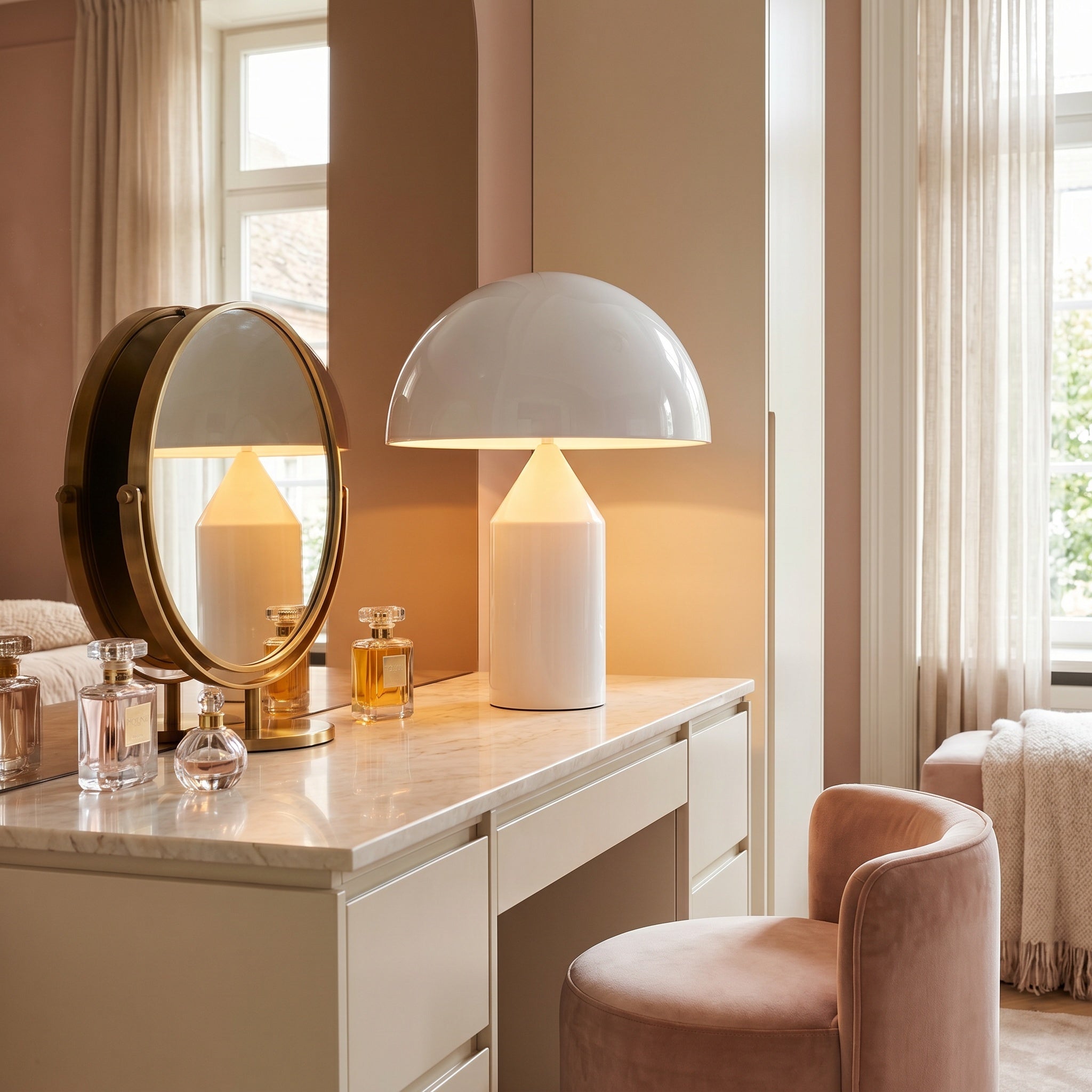 Geometric mushroom table lamp lit beside an armchair at dusk.