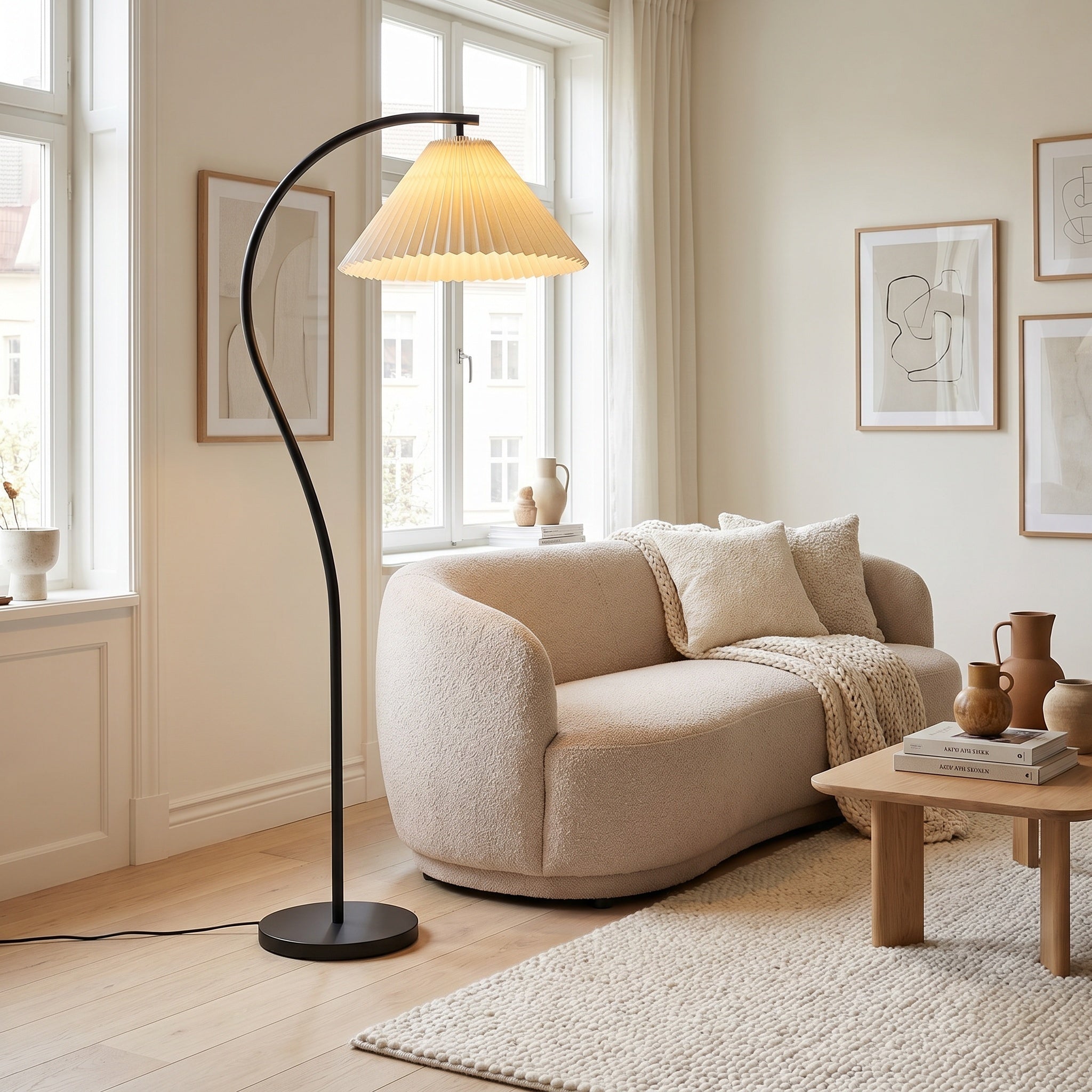 Mafra floor lamp beside seating, pleated linen shade diffusing warm light.