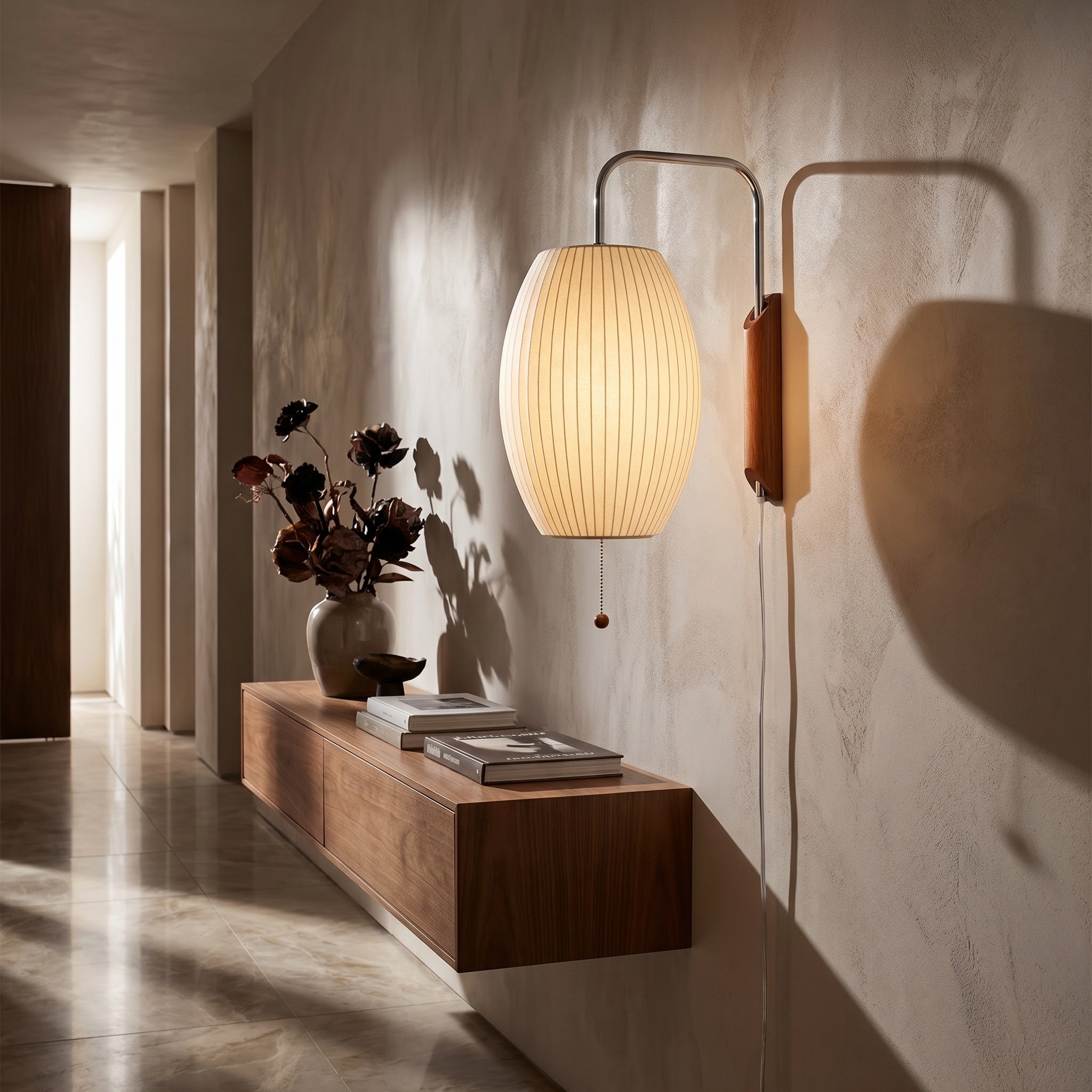 Mirandela globe wall sconce framing a cozy corner with the arm angled down