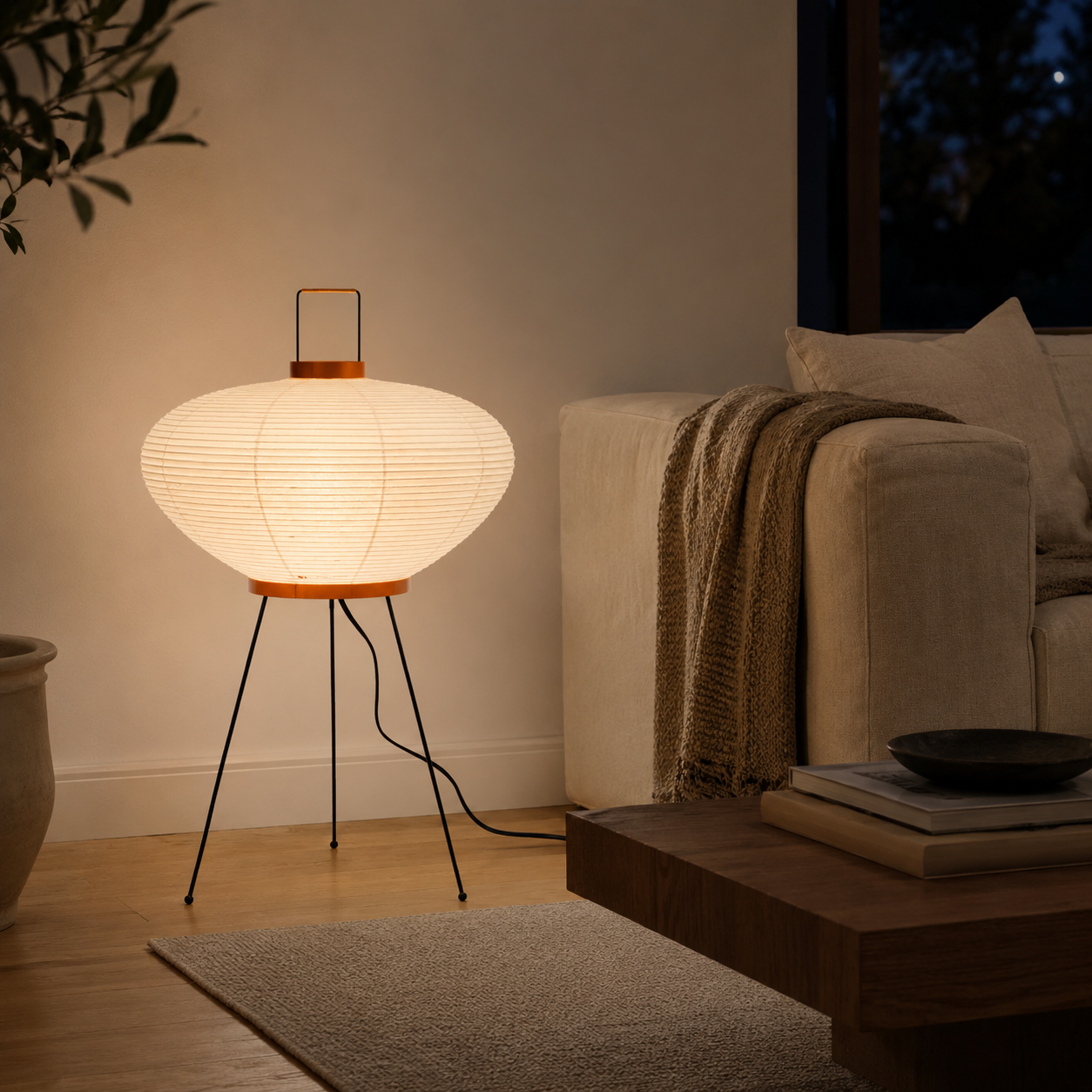 Handmade mulberry paper lamp in a minimalist bedroom.
