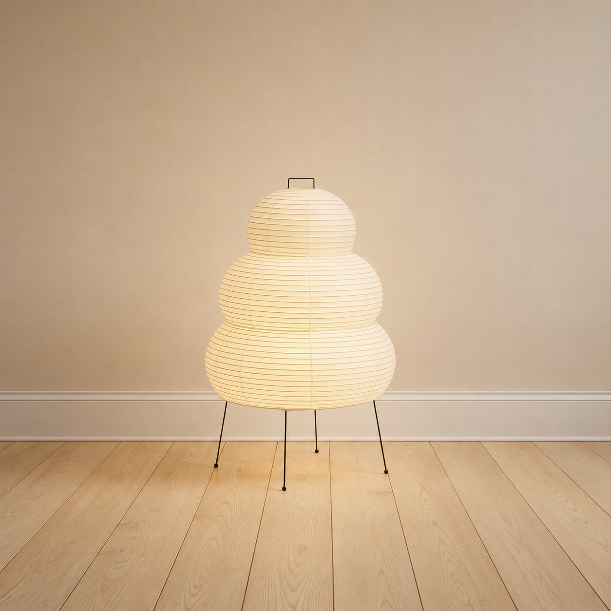 Mulberry paper table lamp, tall lantern form, on a black metal tripod.