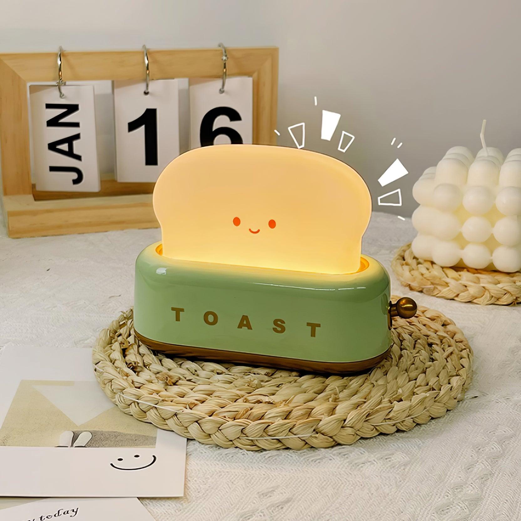 Toaster-shape LED night light on a bedside.