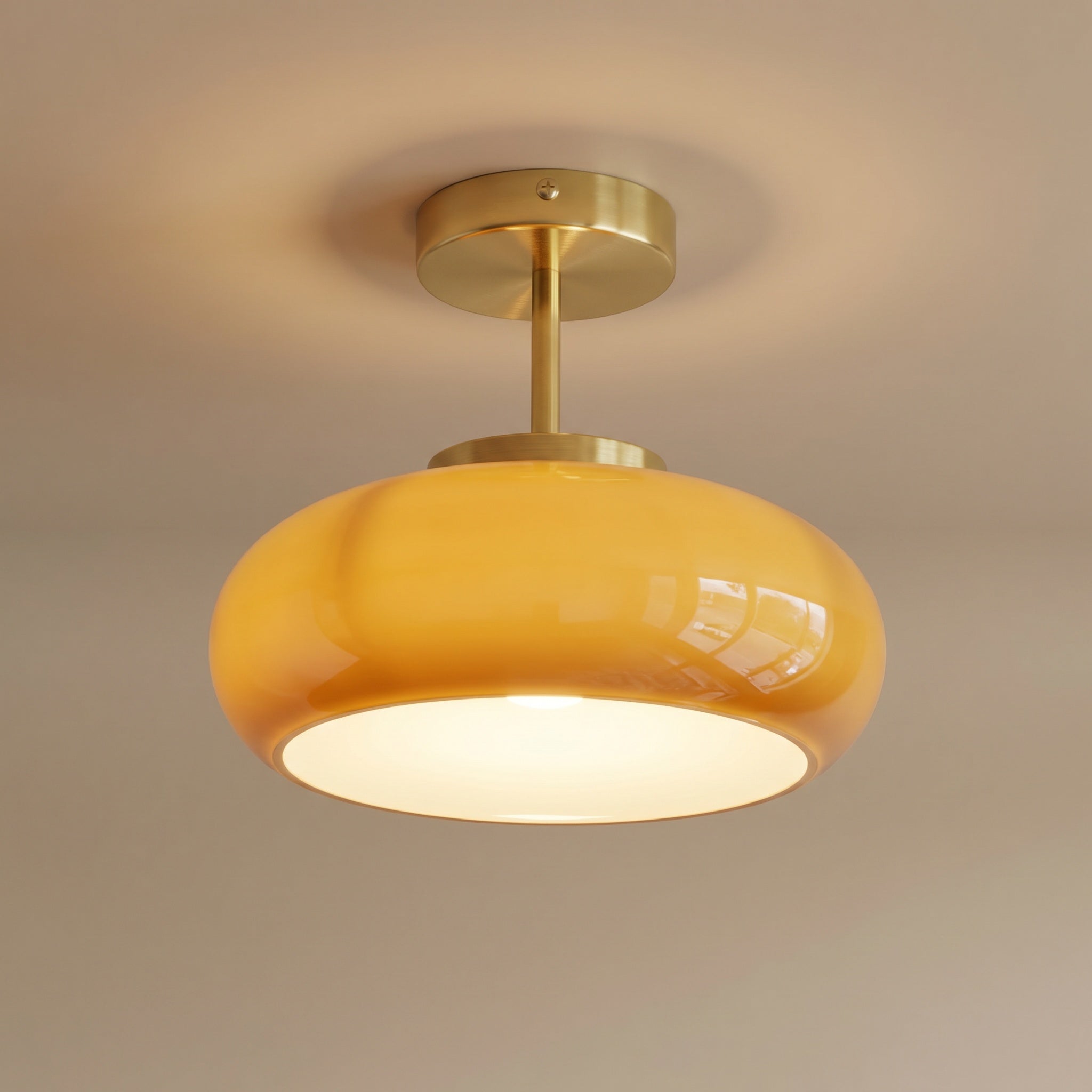 Portalegre semi-flush ceiling light with yellow glass dome and brass frame on white