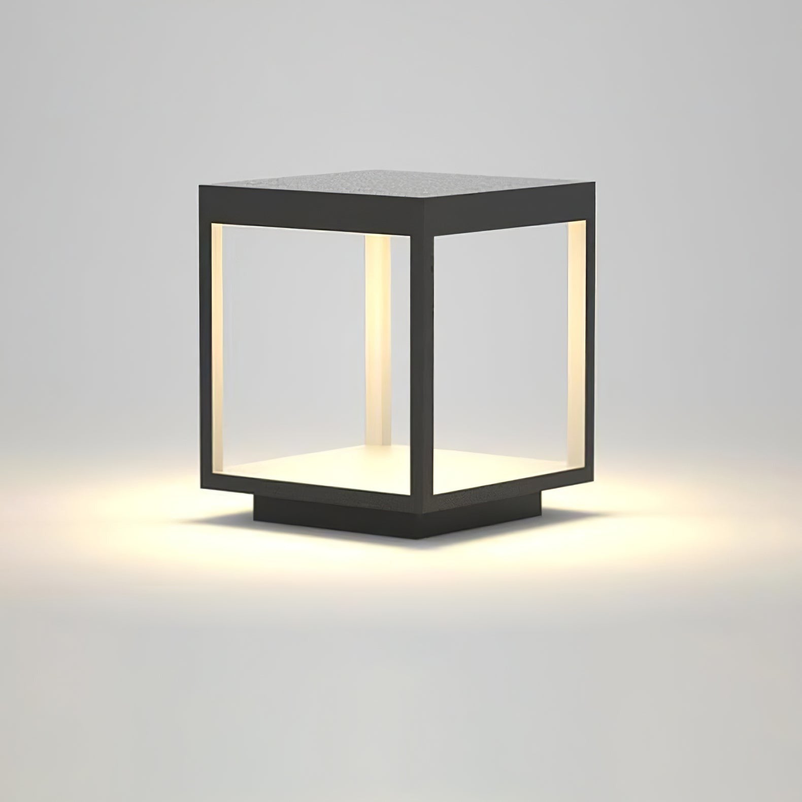 Solar Alcabrichel post light beside decorative garden bed