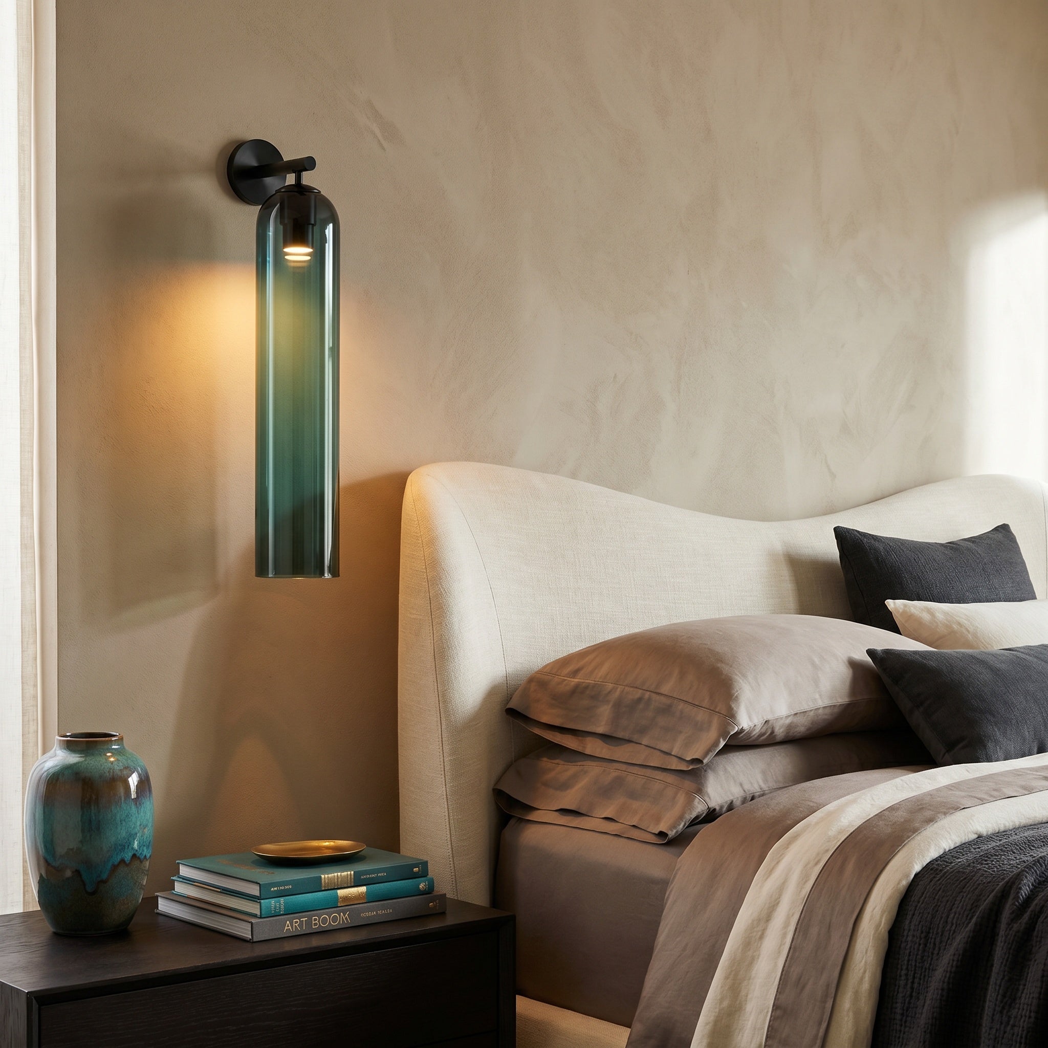 Sortelha wall sconce on a hallway wall casting glow near the stairs