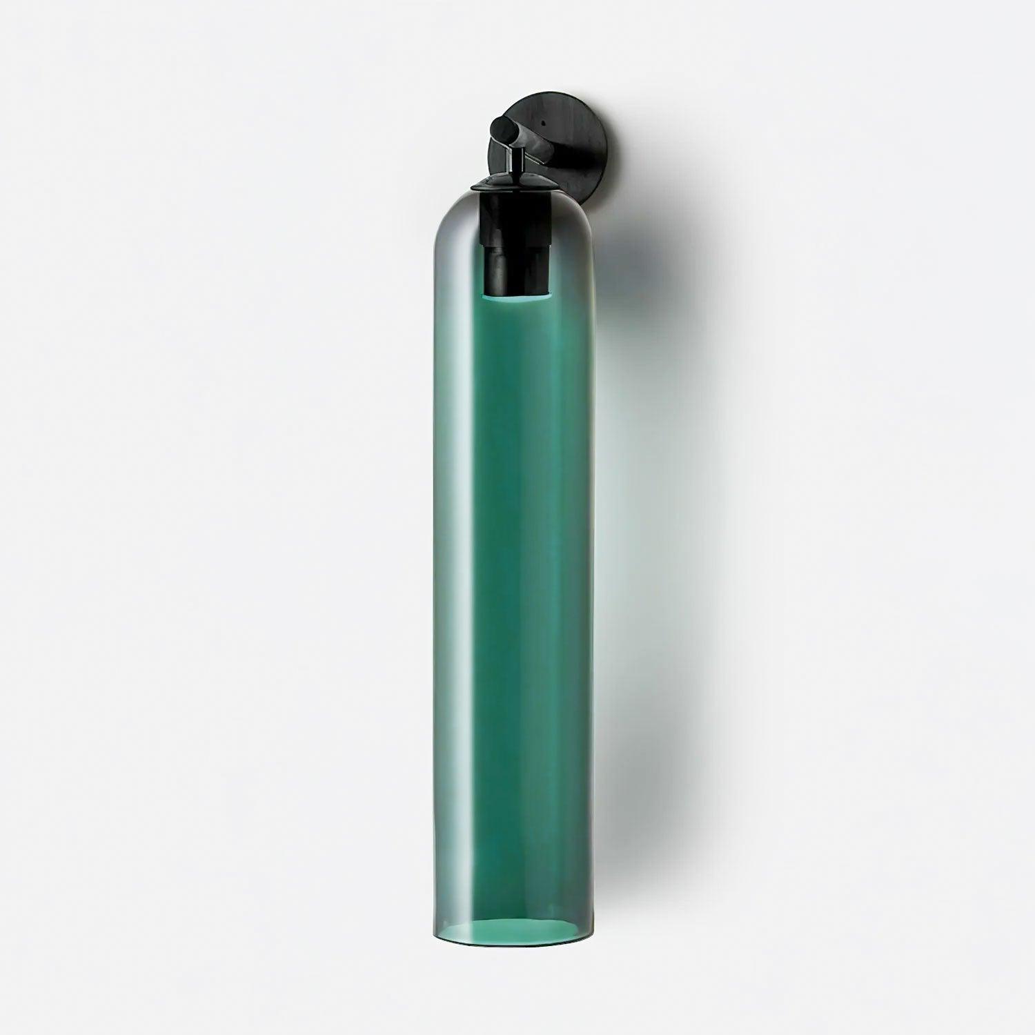 Sortelha wall sconce shown lit with warm glow through the glass shade
