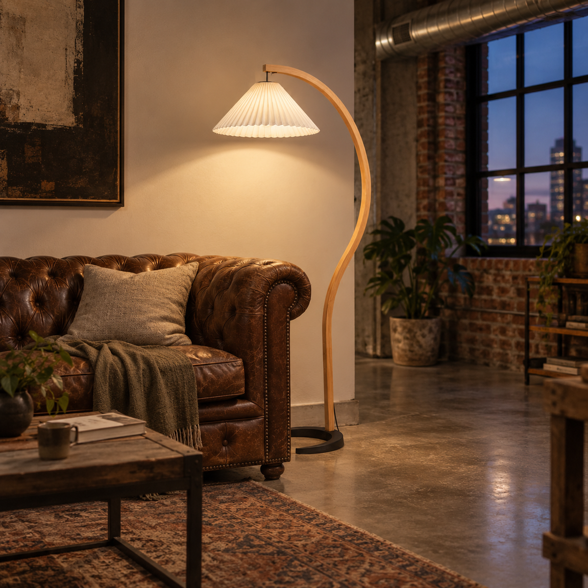 Tomar bentwood pleated floor lamp in beige, in a loft.