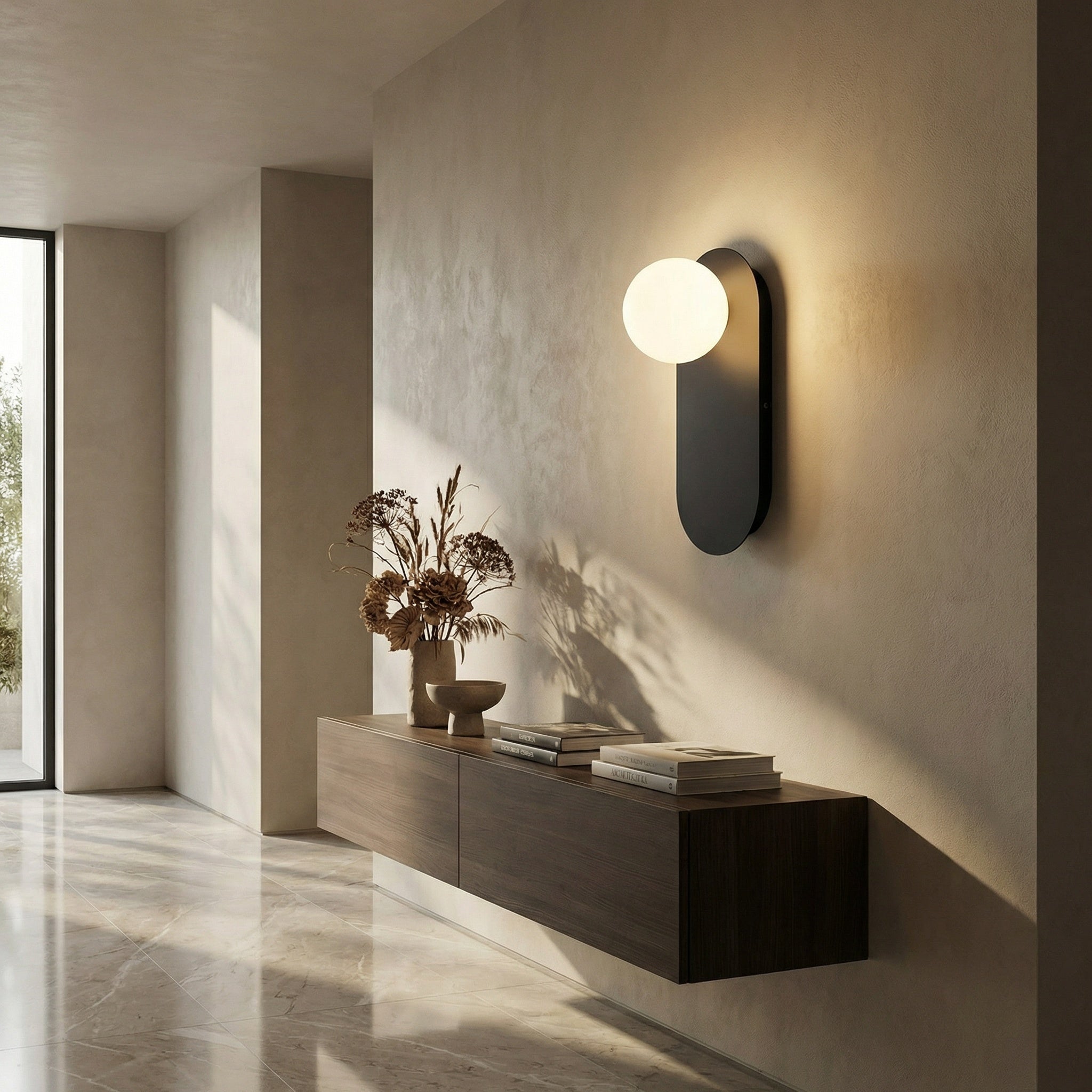 Valença wall sconce above a console table in a calm entryway setting