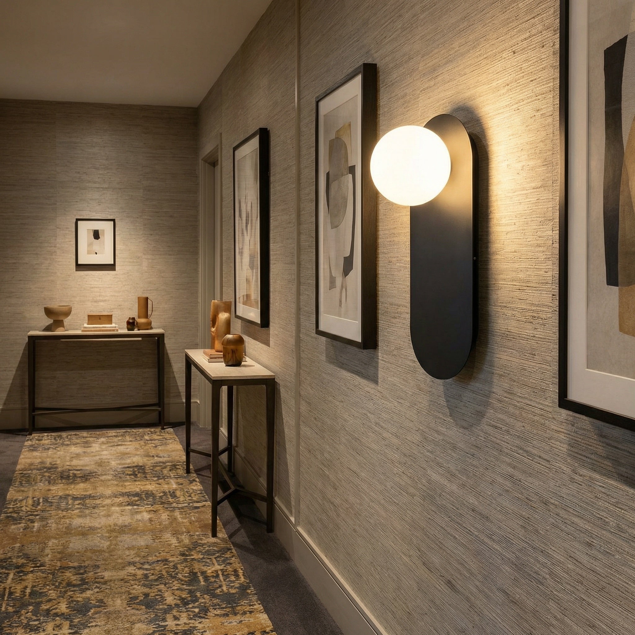Valença wall sconce mounted in a narrow hallway, casting a soft downward glow